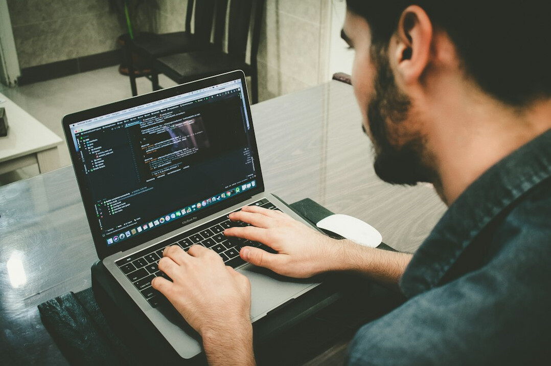japanese programmer at desk