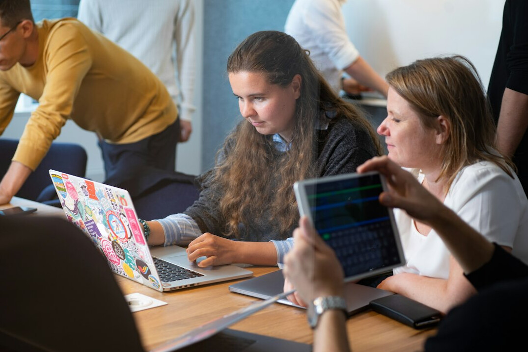 group of friends discussing code